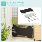Space-saving folded pet grooming table with black tabletop and metal frame, parts shown nearby