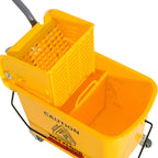 Yellow mop bucket on wheels with perforated wringer basket and water separation panel