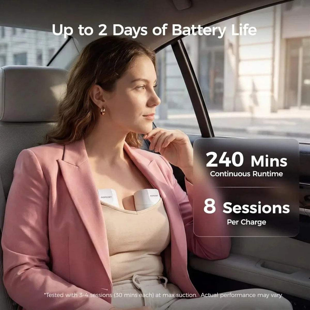 Woman wearing a white wearable electric breast pump on her bra in a car