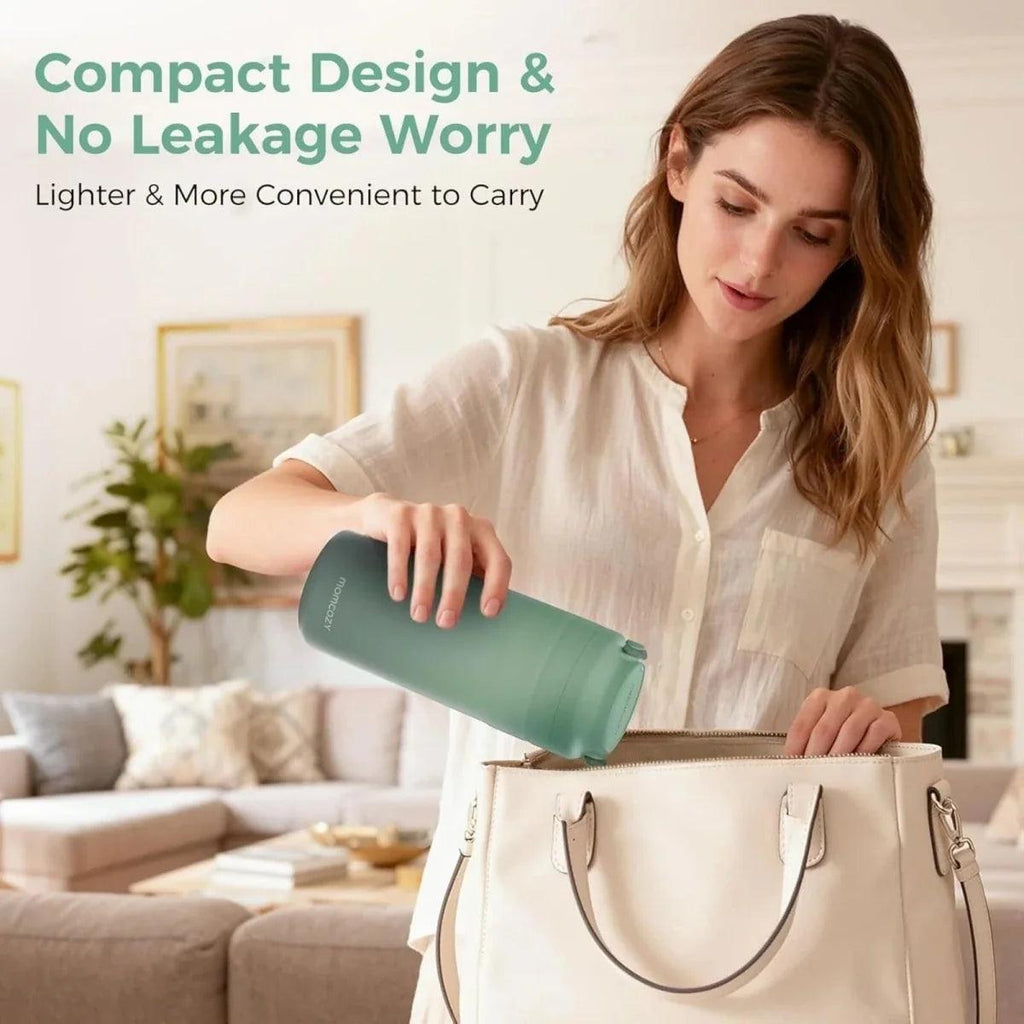 Portable breast milk cooler in mint green with handle and lid; held while carrying