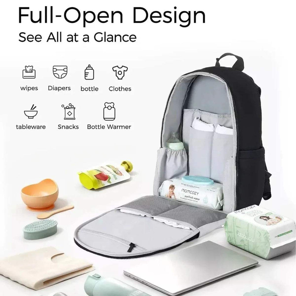 Black changing bag backpack, fully open interior with padded sections and organizer