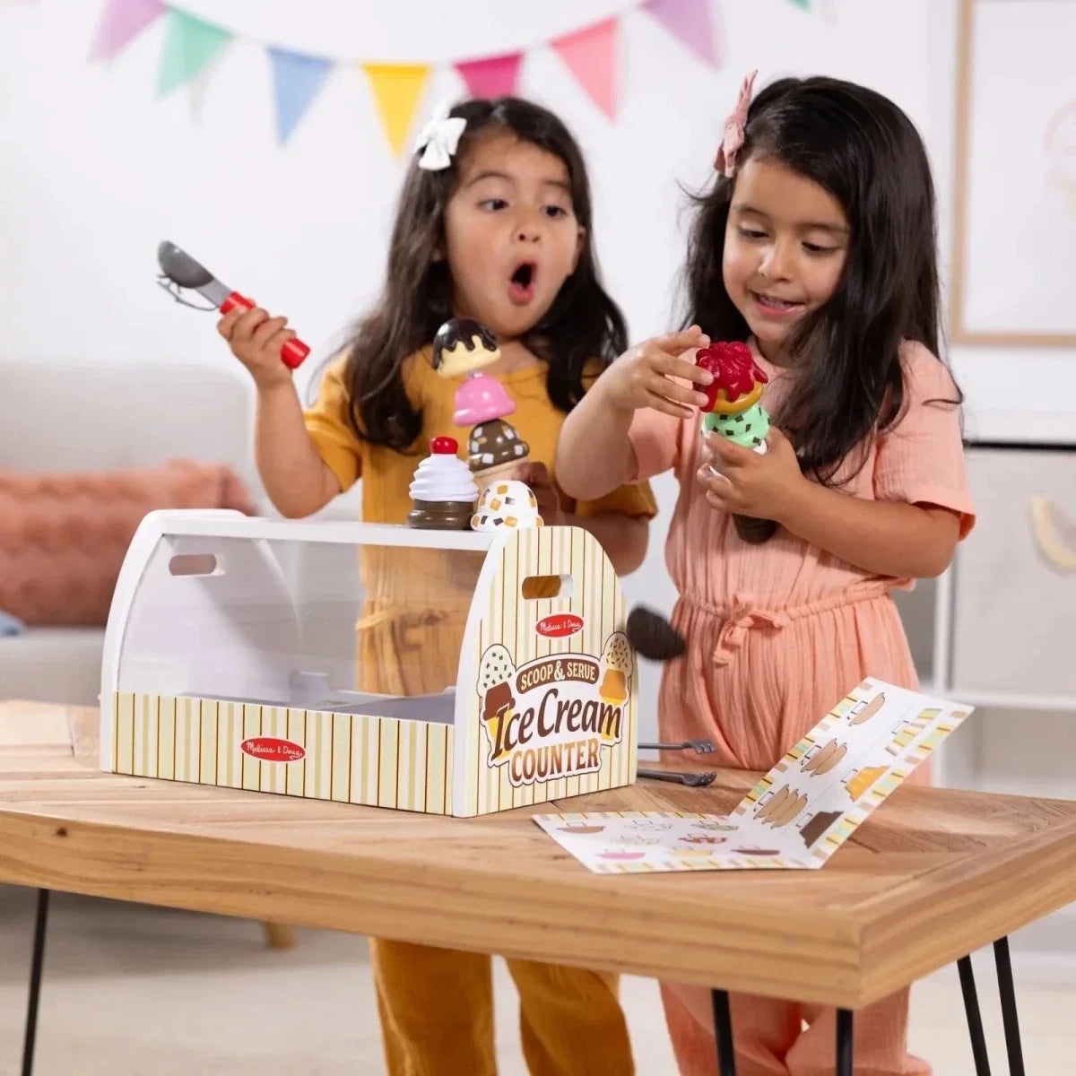 Wooden ice cream counter play set on table with toy ice cream cones