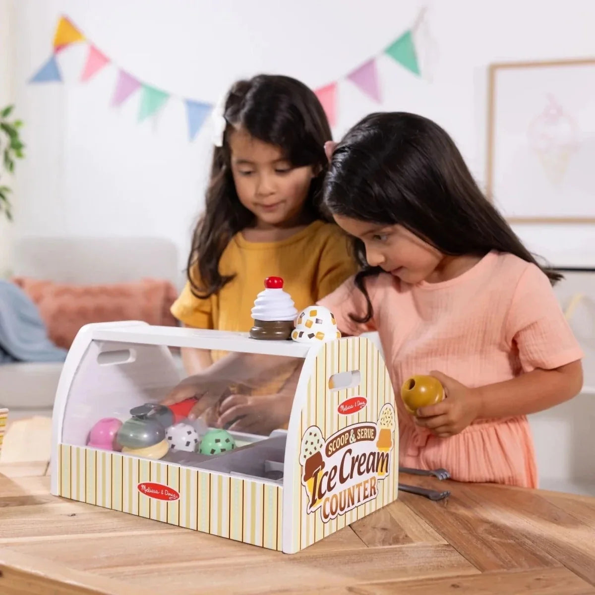 Wooden ice cream counter play set with toy scoops and serving pieces