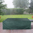 Green patio furniture cover draped over a square outdoor set with full coverage.
