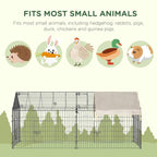 Rectangular metal small-animal playpen with beige roof and dark arched corner