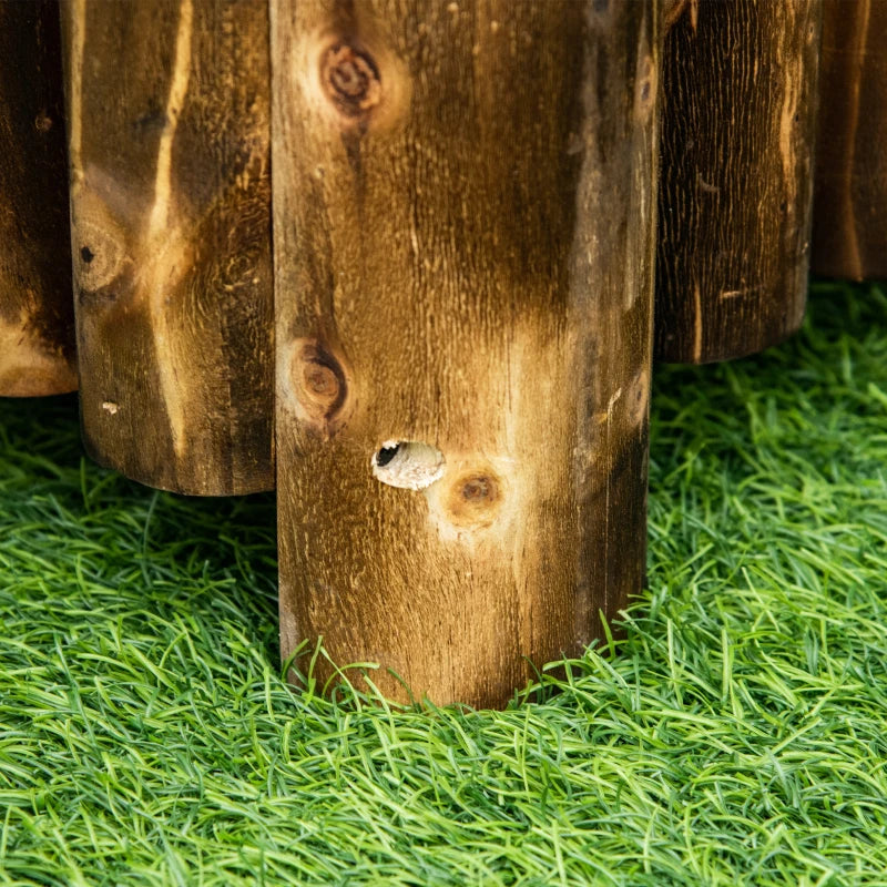 Wooden raised garden bed corner leg detail standing on grass.