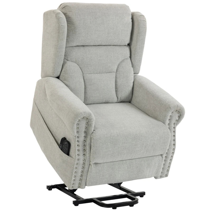Light grey chenille power lift recliner chair with padded arms and studded trim.