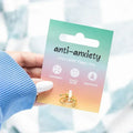 Gold tone anti-anxiety adjustable fidget ring with round beads on card