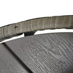Grey round outdoor table close-up of slatted wood-effect top surface