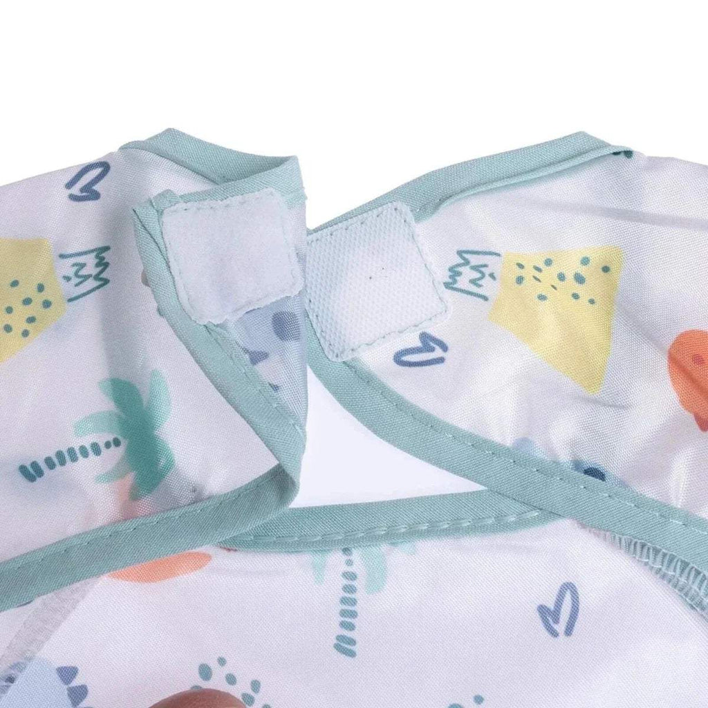 Baby coverall bib shoulder seam detail with light blue trim and dinosaur print