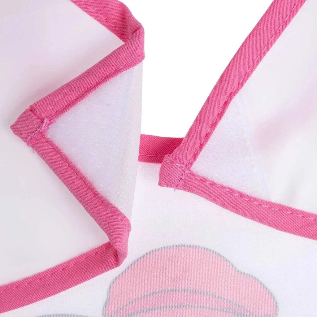 Close-up of pink strap stitching and soft white bib fabric.