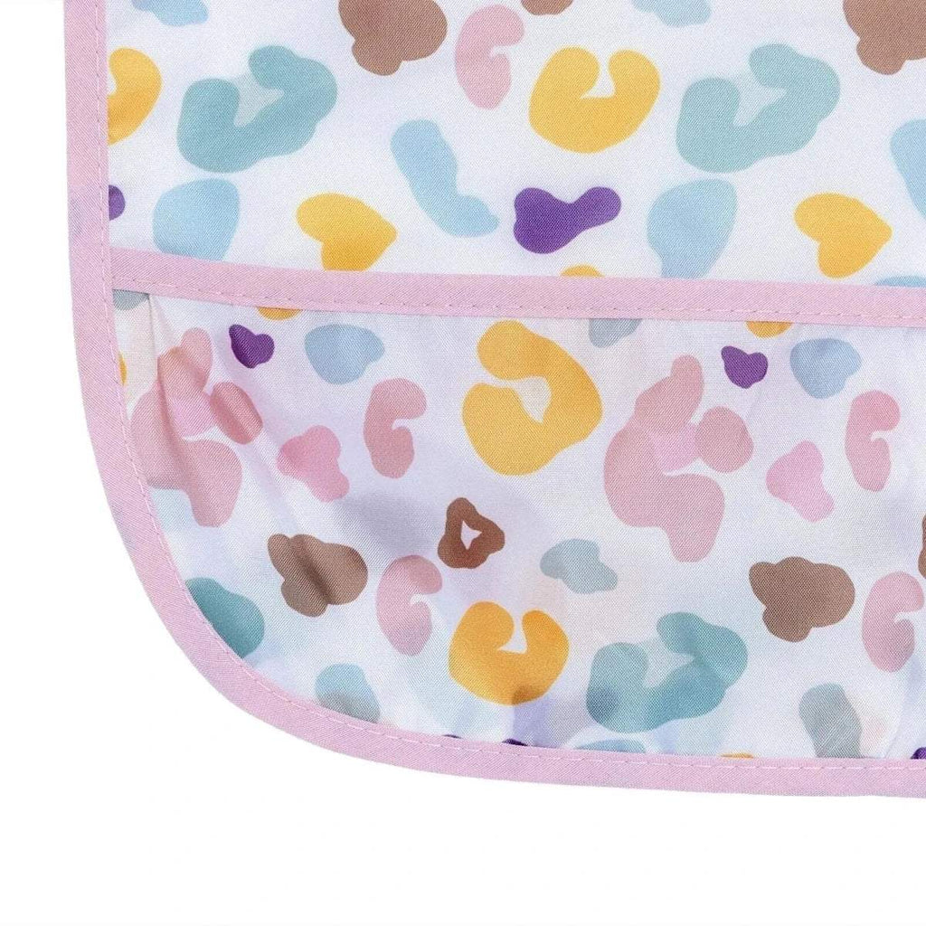 Baby coverall bib front pocket close-up with multicolor pattern and pink border