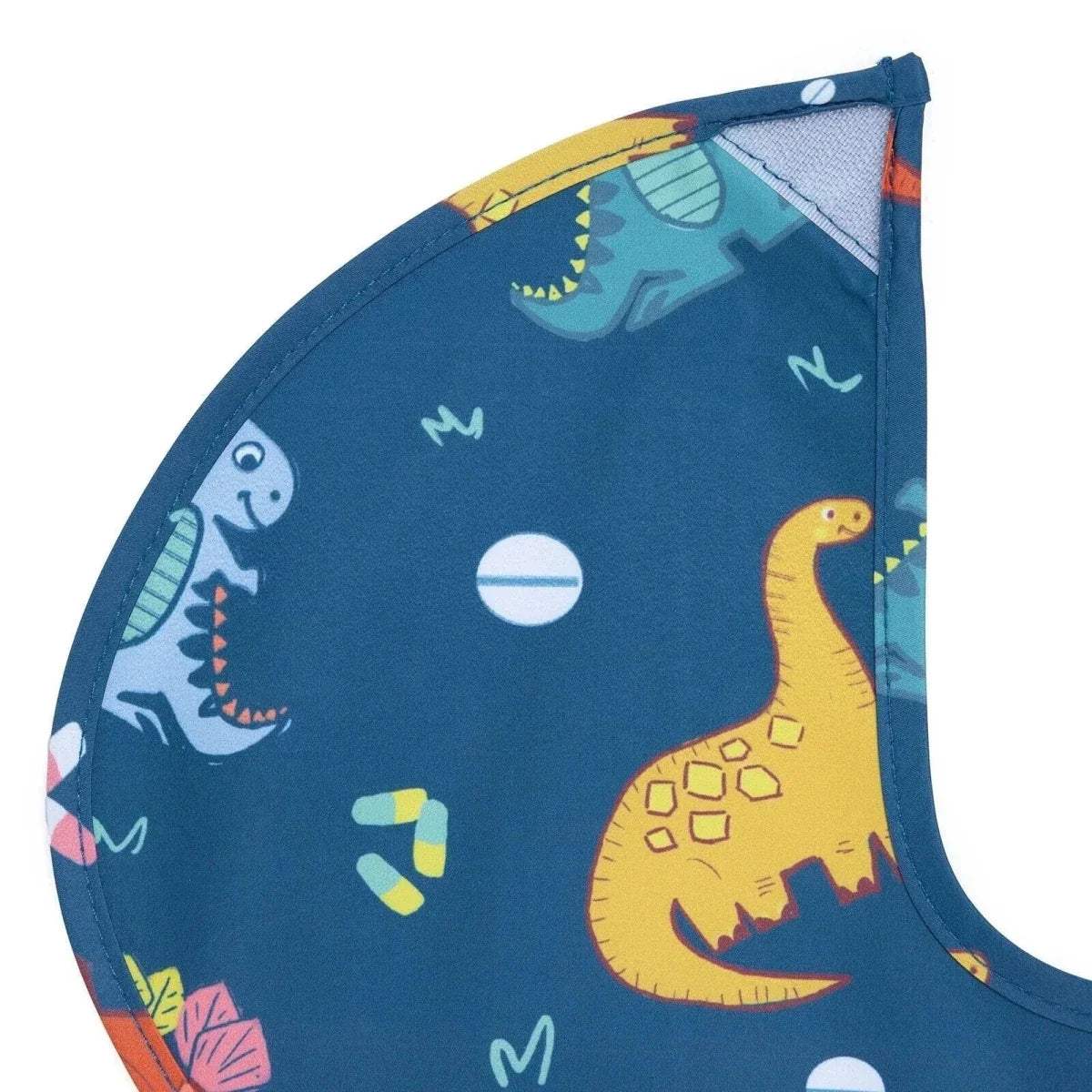 Blue baby bib fabric with dinosaur illustrations and stitched side seam details