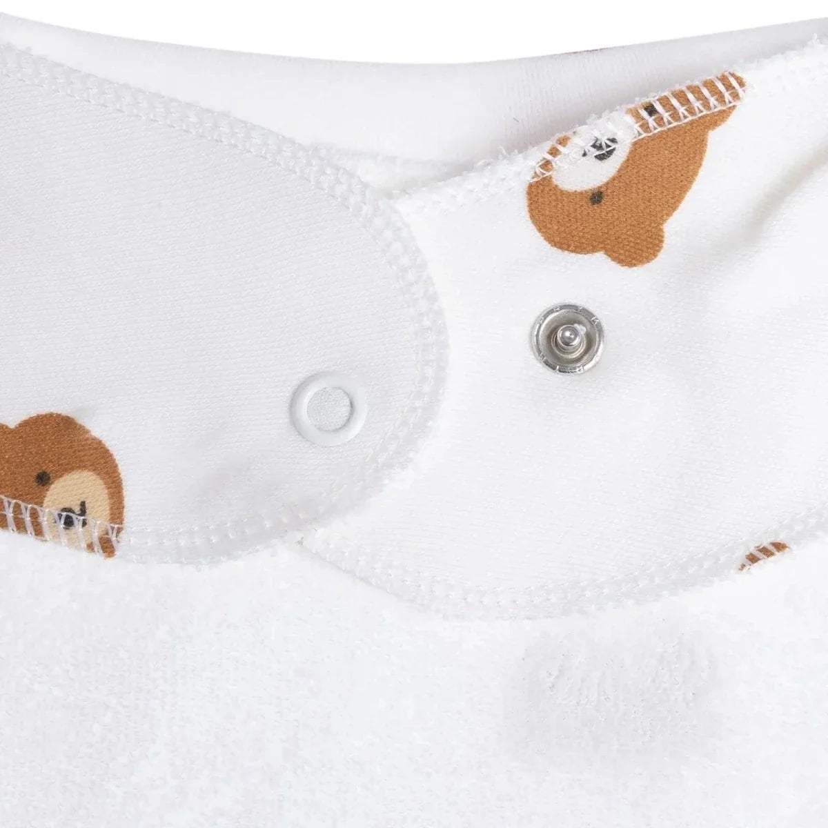 White cotton bandana bib with stitched edge and snap closure; teddy print accents