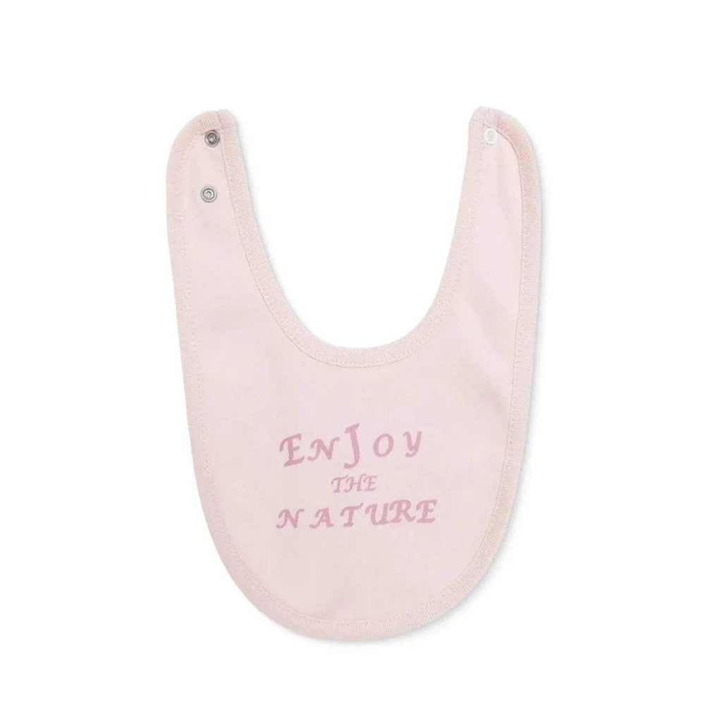 Light pink baby bib with embroidered-style text design at the center and snap button.