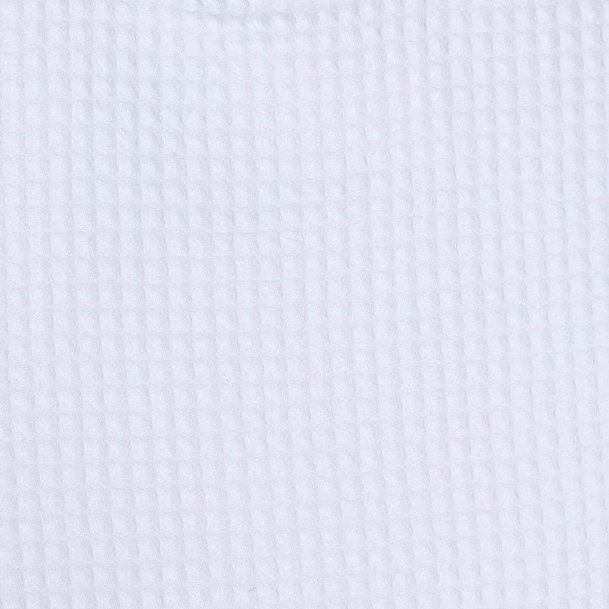 Close-up of white waffle-textured baby bib fabric