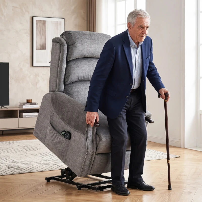 Light grey lift recliner chair assisting an elderly man standing up
