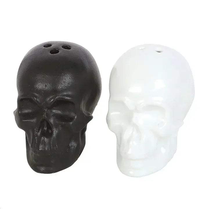 Skull salt and pepper shakers set with dark and white skull heads, side-by-side