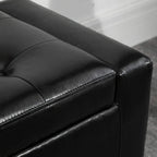 Close-up of black PU leather ottoman with tufted top, stitched seam, and smooth finish