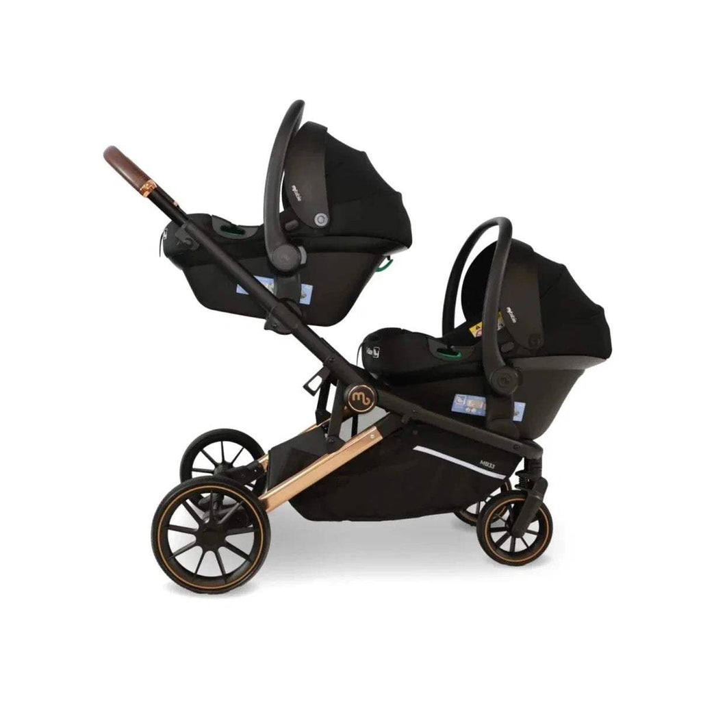Tandem pushchair with two black seat units, black canopy tops, and brown handle accents
