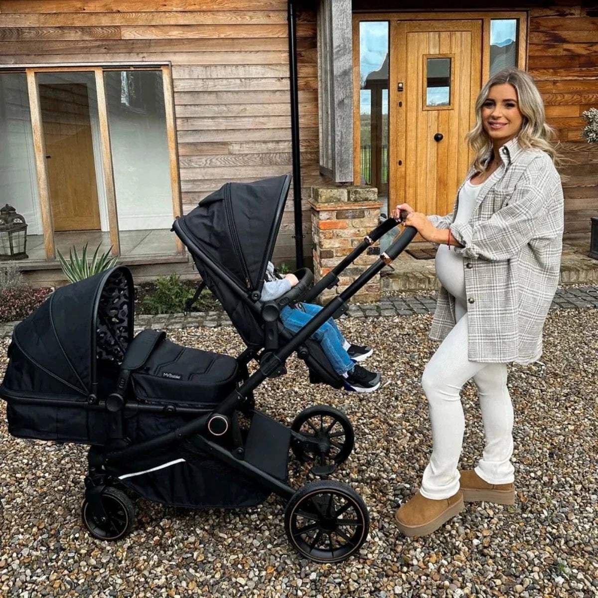 Black pushchair with padded seat liner, side view