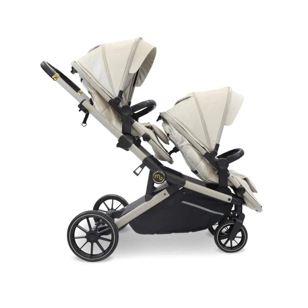Ivory tandem pushchair angled view showing two seats, black wheels, and frame
