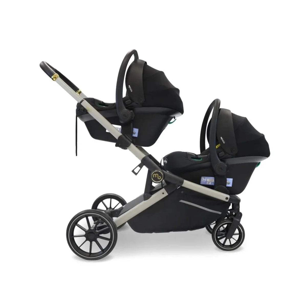 Black tandem pushchair with two seats, black canopies, and ivory frame trim