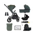 Forest green travel stroller with canopy, black wheels, and included accessories