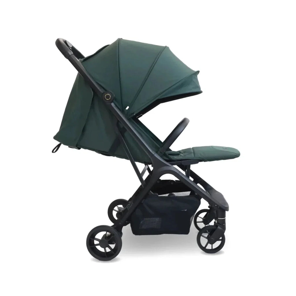 Forest green compact stroller with canopy and footrest in side profile