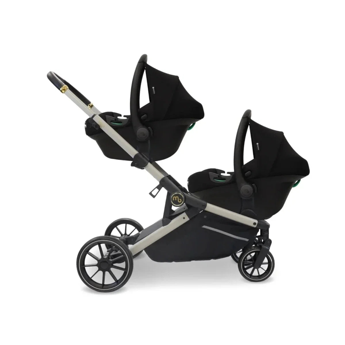 Twin travel stroller in ivory and black with two carrycots and black seat base