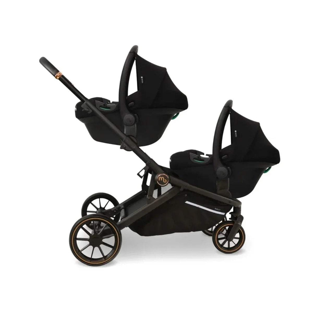 Black twin stroller with two canopy seats and tan-trim wheels, front view