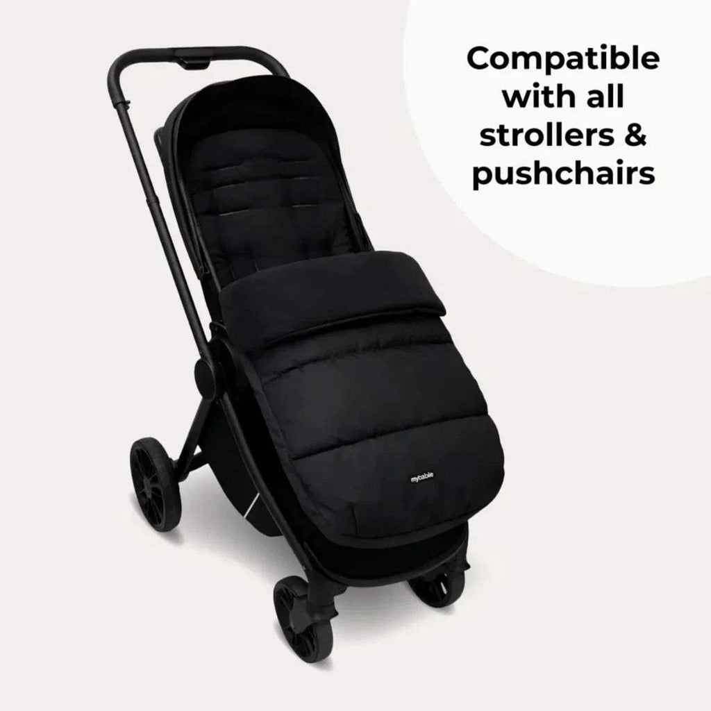 Dark stroller seat with large wheels, padded cover, and side profile