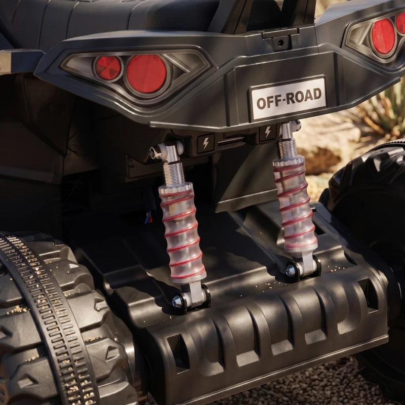 Black electric quad bike close-up of rear suspension and spring shocks, rugged frame details