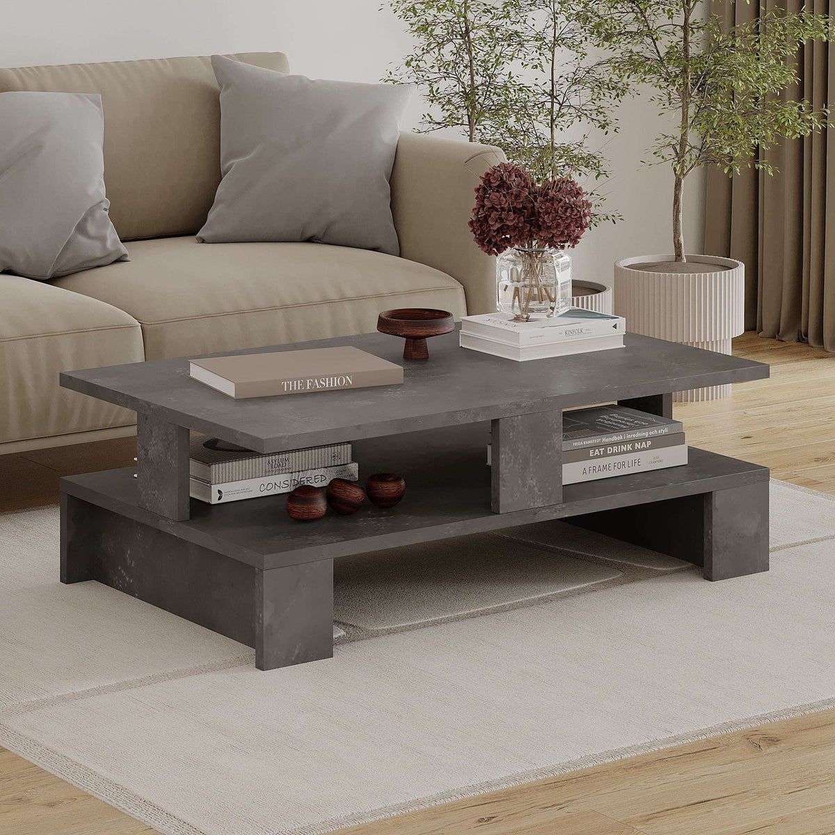 Dark grey multipurpose coffee table with open storage shelves, 27.5 cm high.