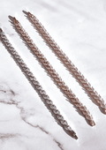 Marquise-cut petal bracelet with linked oval stones, slender chain, rose-gold tone.