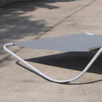 Grey double rocking sun lounger daybed with curved metal frame and headrest cushion