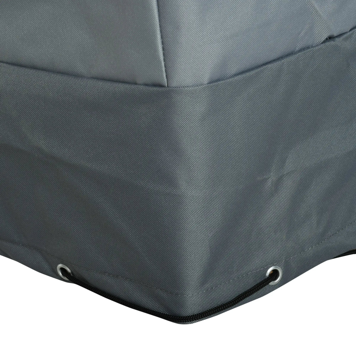 Close-up of patio cover hem with metal eyelets and elastic cord