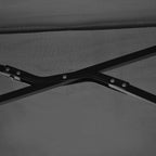 Black umbrella canopy fabric with metal rib joints, close-up