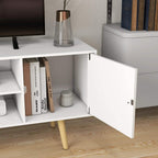 White TV stand cabinet interior with open shelf and storage compartment door.