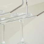 Clear glass stemware rack arms with multiple holders under the cabinet top