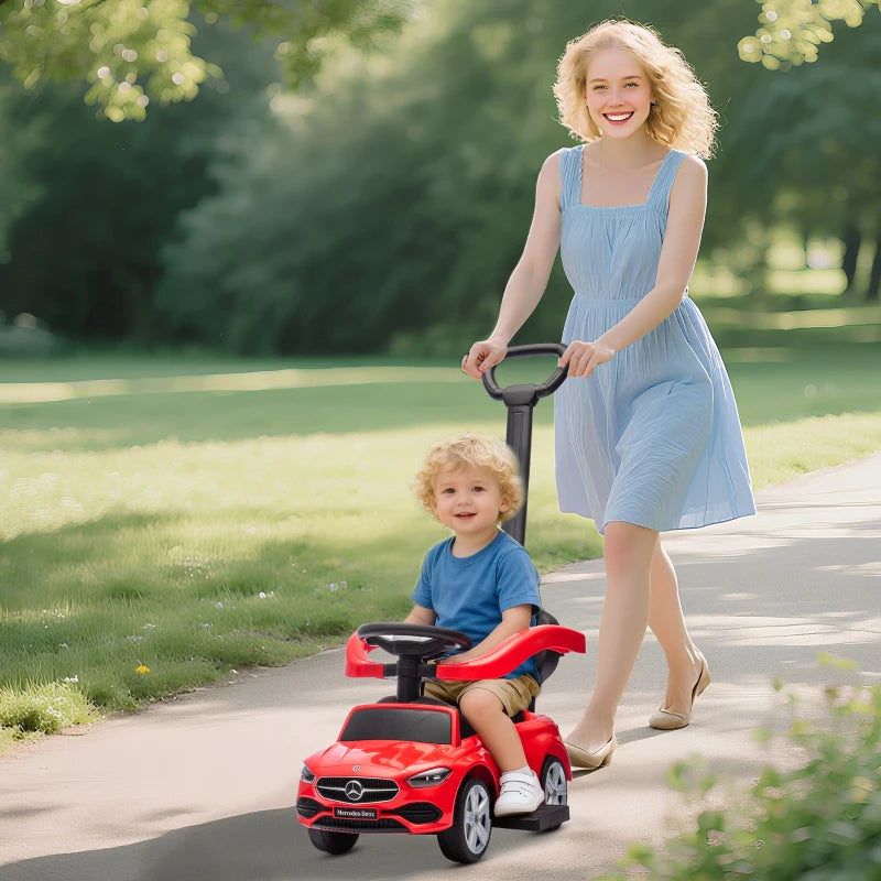 Red Mercedes-Benz C-Class ride-on push car with large wheels and tall handle