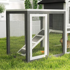 Grey and white outdoor wooden small animal hutch with wire doors and central ramp inside