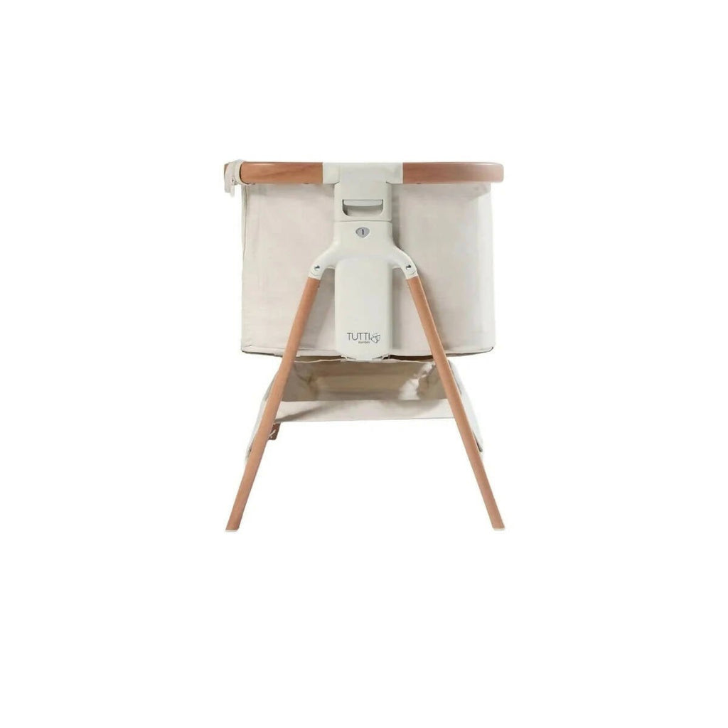 Ecru and walnut bedside crib with canopy top and four wooden legs