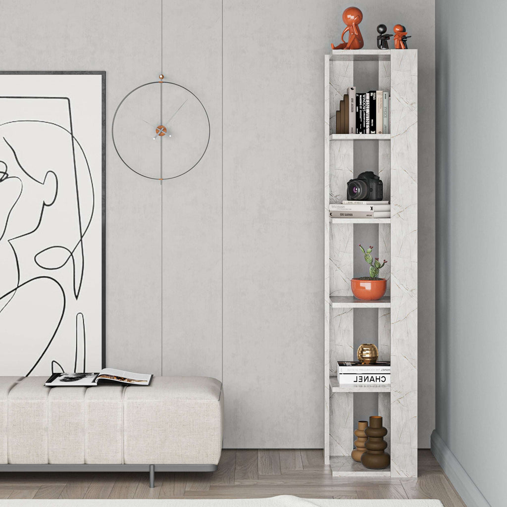 Tall narrow white bookcase with open shelves, filled with books, camera, and small decor.