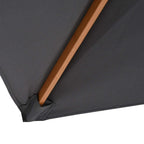 Corner detail of dark grey parasol canopy with stitched edge and wooden support