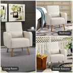 Cream upholstered accent chair with pillow and tapered wooden legs