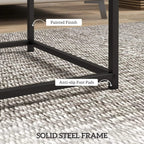 Black steel frame nest table with anti-slip foot pads; painted finish close-up