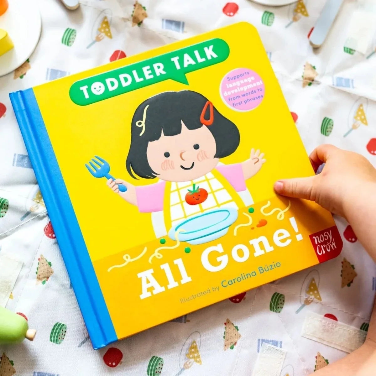Toddler Talk board book cover, yellow with girl and “All Gone!” title, held open