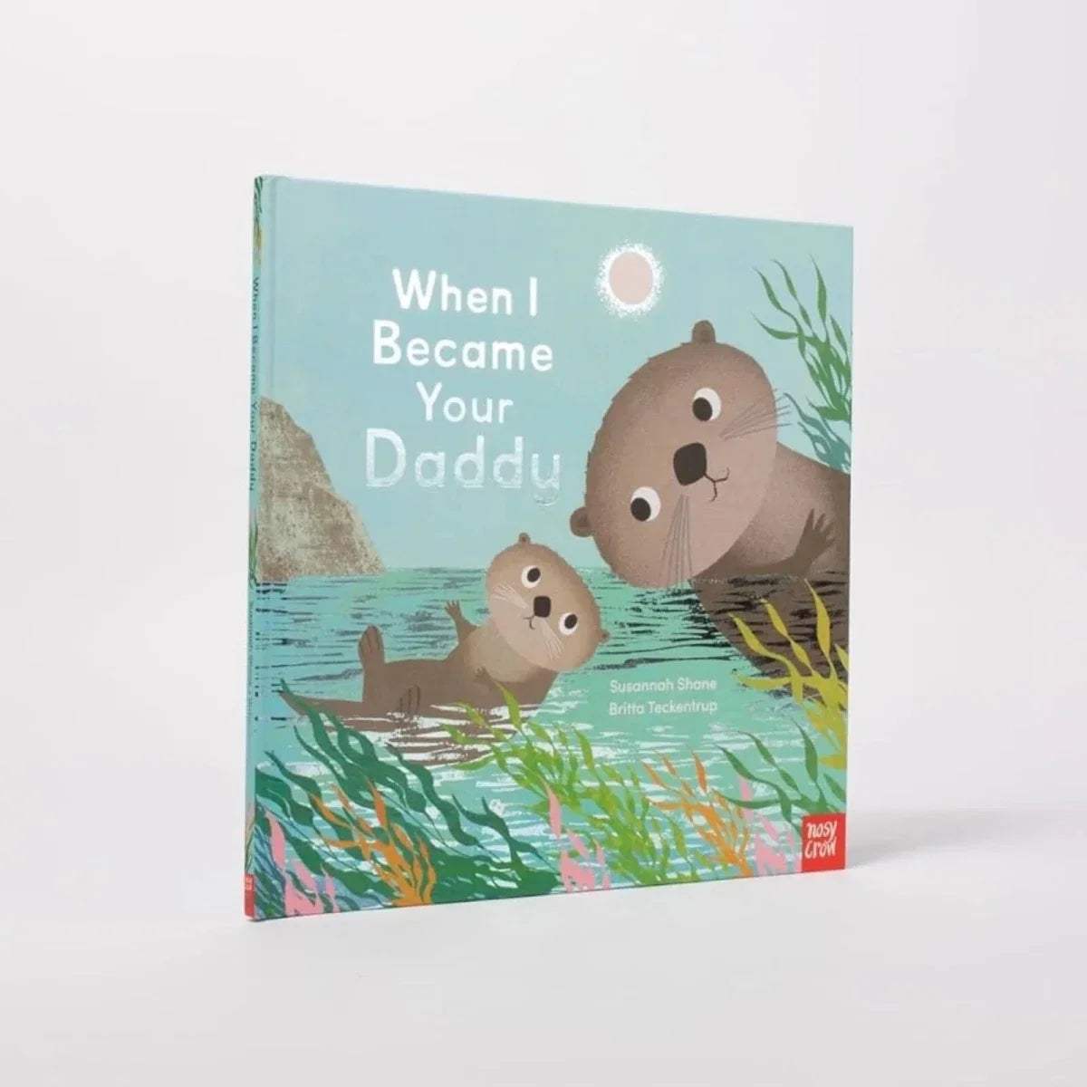 Children's picture book cover, teal ocean scene with otters floating and title text