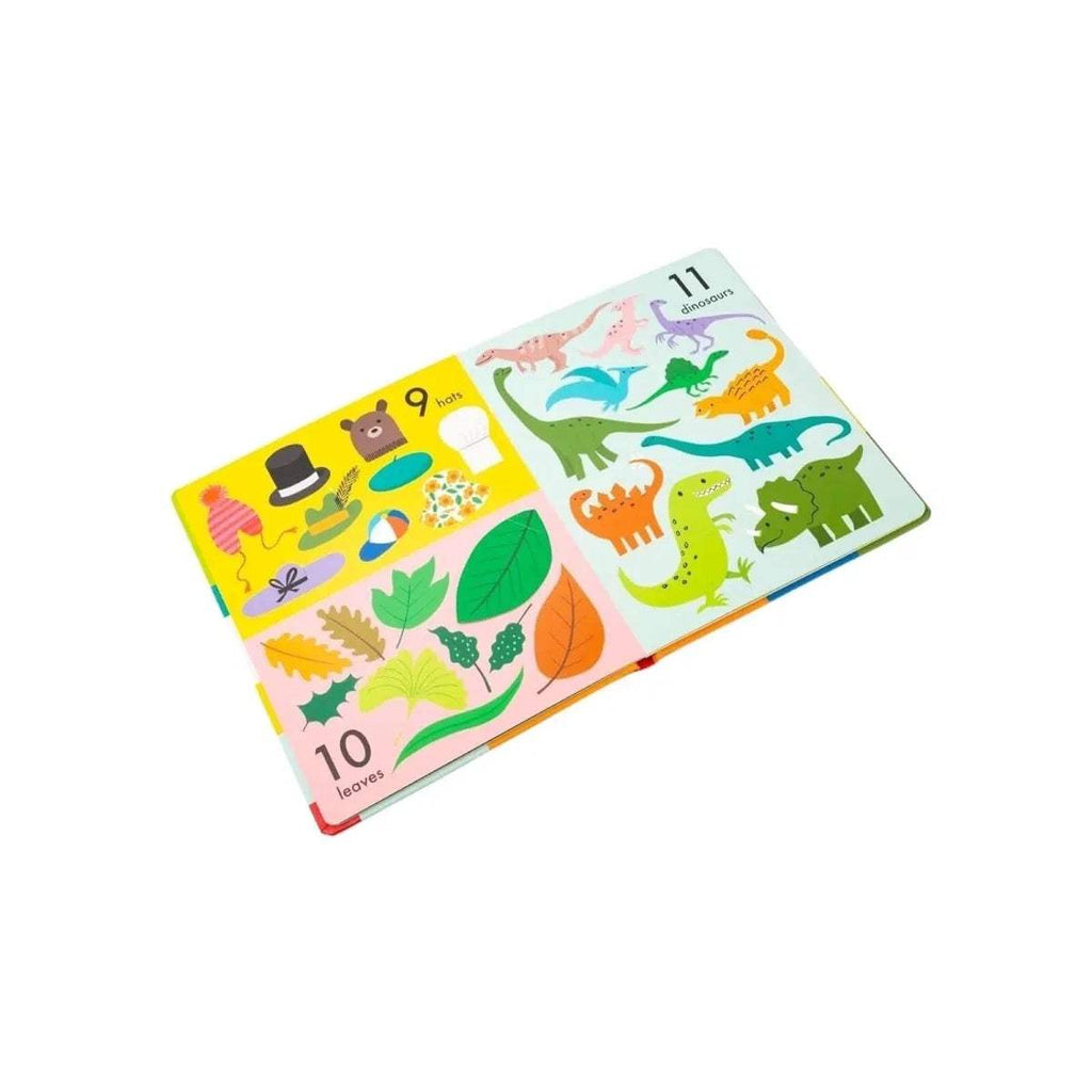 Open children’s lift-the-flap board book pages with dinosaurs and nature scenes